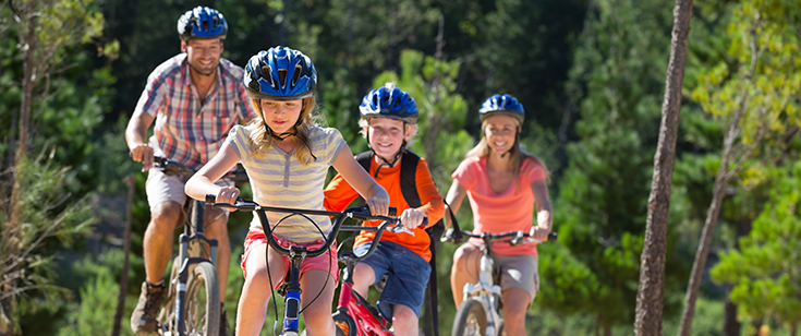 Family riding bikes