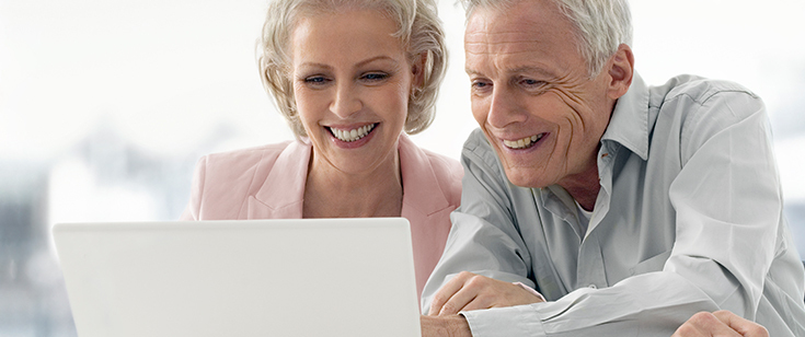 Retired couple looking at laptop Retired couple looking at laptop
