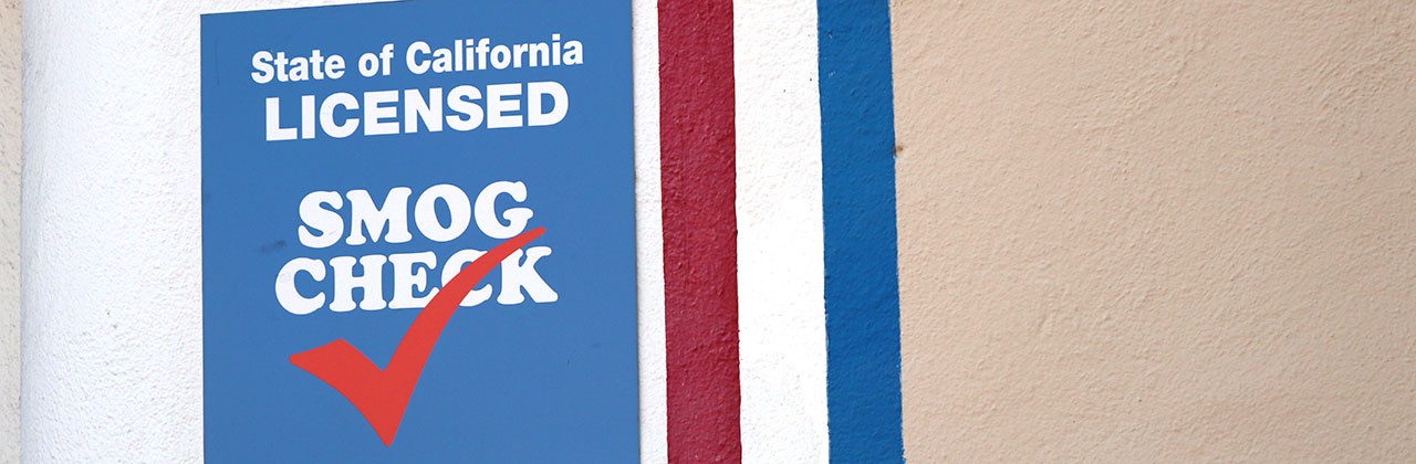 A Smog Check sign outside a California smog check location