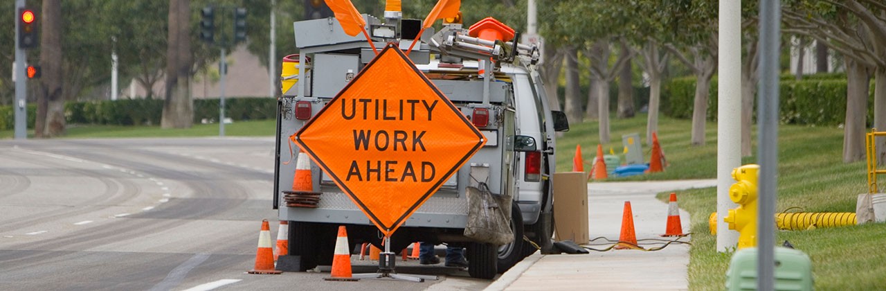 A utility crew on the side of the road