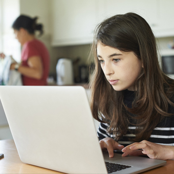 Young girl using laptop