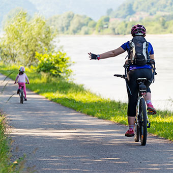 Woman using hand signal on bike Woman using hand signal on bike