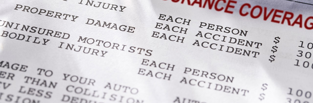 Auto insurance policy terms printed on a sheet of paper
