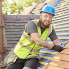 Man in construction vest and helment working on roof