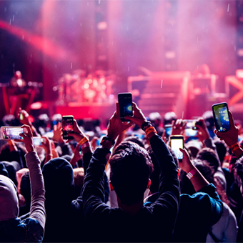 Fans filming concert with cell phones