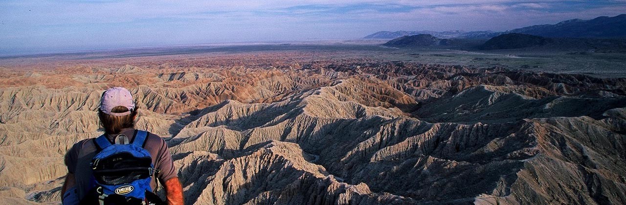 A hiker looks over the Borrego Badlands in Anza-Borrego Desert State Park