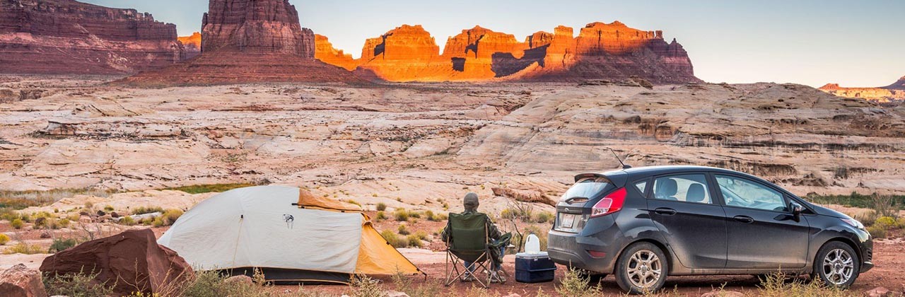 Camper off Bicentennial Highway, over Dirty Devil River canyon, moon rising at sunset, Glen Canyon National Recreation Area, Colorado Plateau, Utah