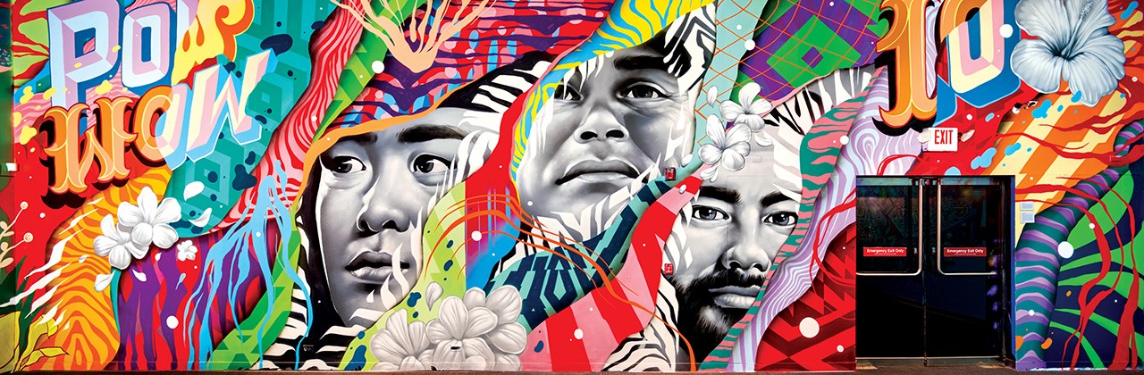 A mural by Tristan Eaton of Los Angeles and his brother Matt Eaton of Detroit gives face time to (from left) artists Jasper Wong, Kamea Hadar, and Jeffrey Gress. | Photo by Brandon Shigeta