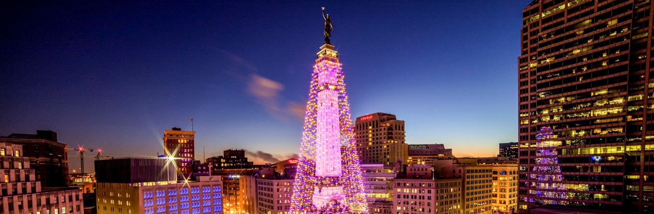 Monument Circle illuminated with strings of lights for the holidays