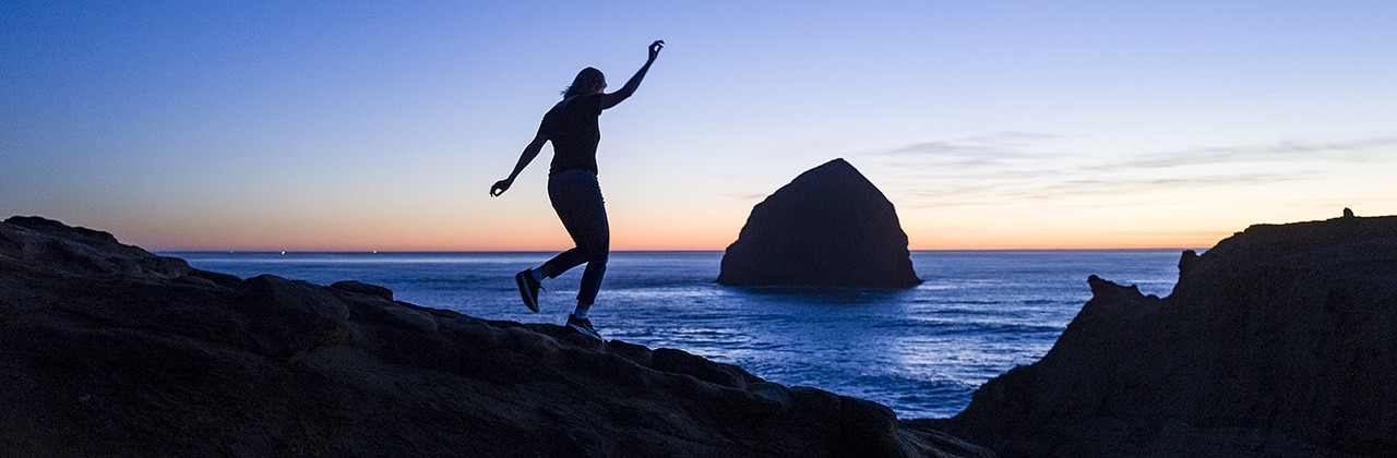 Woman on rocks at Cape Kiwanda