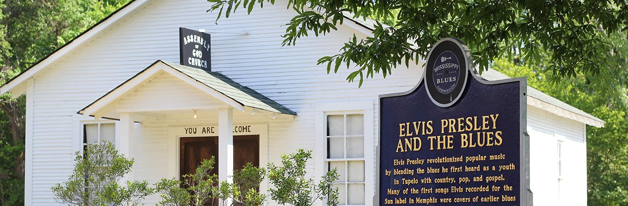 A sign outside Assembly of God Church detailing Elvis Presley's connection to the church