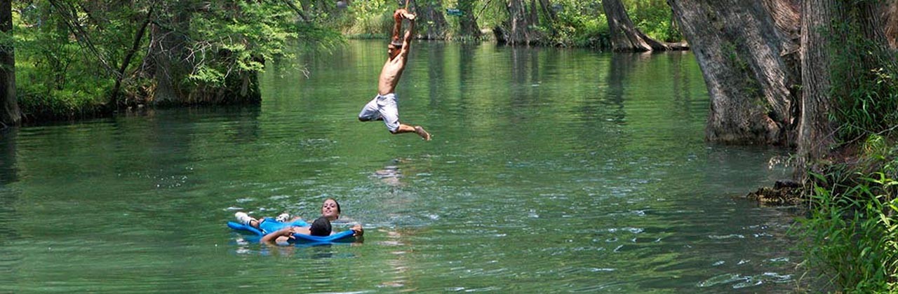 Swimming at the Blue Hole on Cypress Creek near Wimberley, Texas