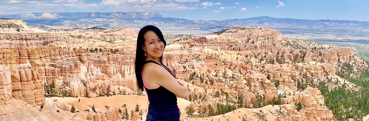 Author Christine Lee admires the view at Bryce Canyon National Park, a stop on the Enchanting Canyonlands tour of the Southwest.