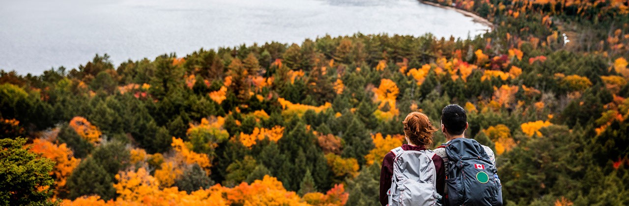 A young couple hiking in Algonquin Provincial Park in Ontario, Canada