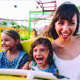 Mom and 2 kids riding roller coaster