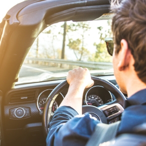 man driving convertible