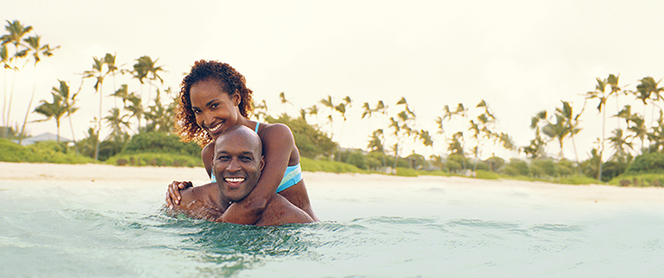 Couple embracing in ocean Couple embracing in ocean