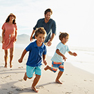 496798249-family-running-on-beach-136x136