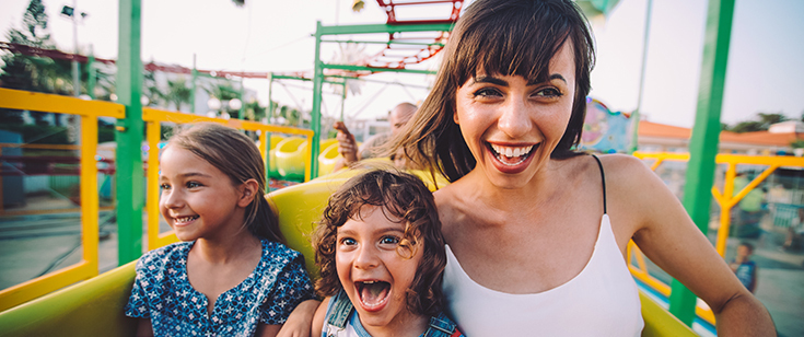 Mom and kids on roller coaster