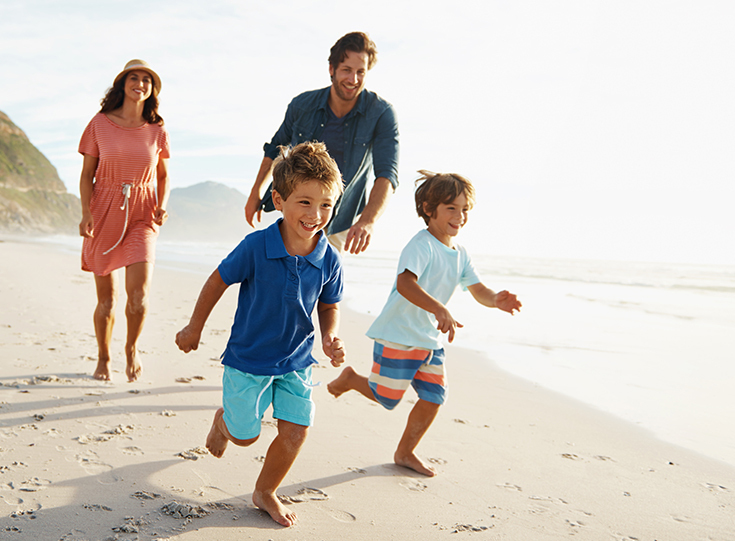 Family running on beach Family running on beach