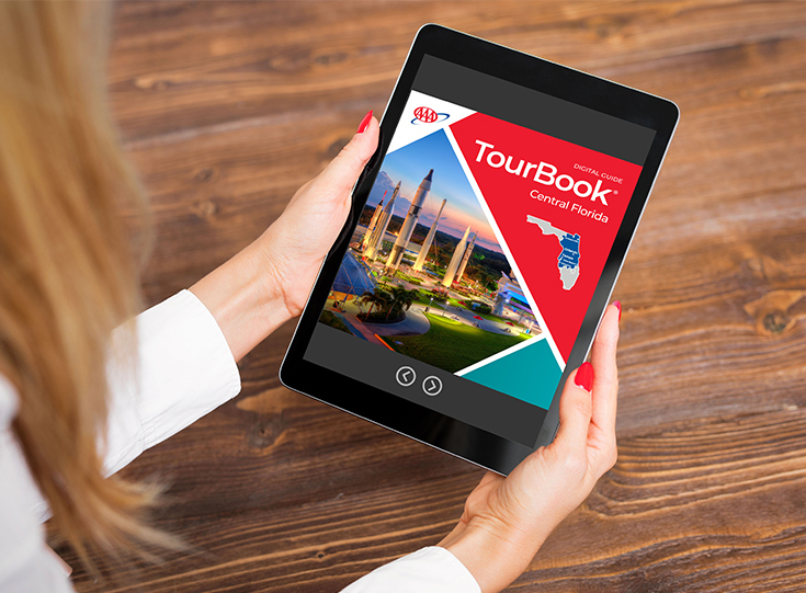 Digital version of Florida AAA TourBook Guide A digital AAA TourBook Guide for Florida shows on a tablet screen