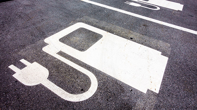 A parking space marked with an electric charging station symbol
