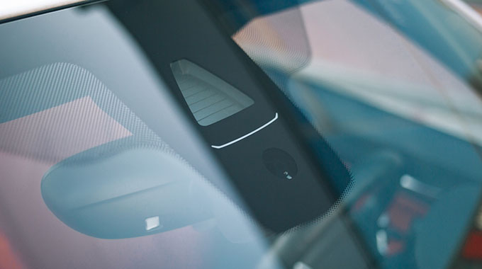 A car camera sensor built into the rear-view mirror system