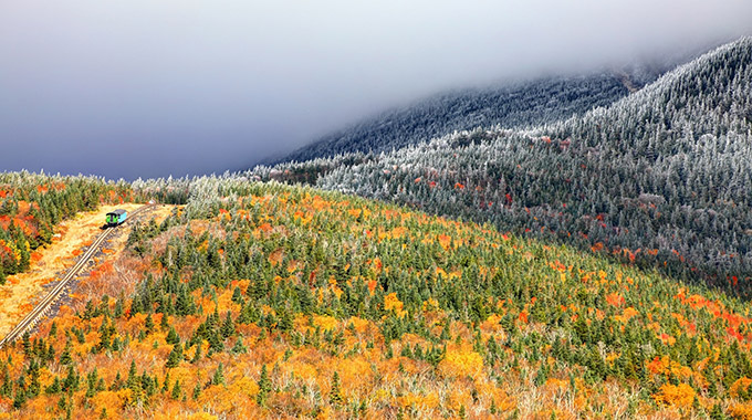 The Mount Washington Cog Railway climbing the mountainside among trees