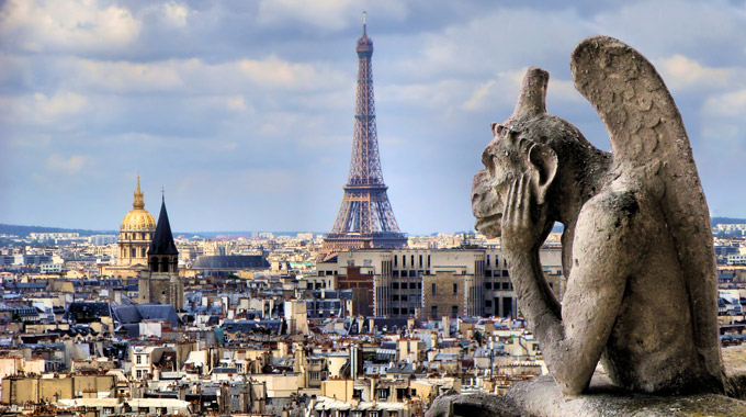 Gargoyle overlooking Paris, with the Eiffel Tower in the background