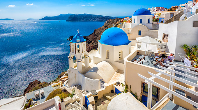 The iconic blue domes of Santorini, Greece.