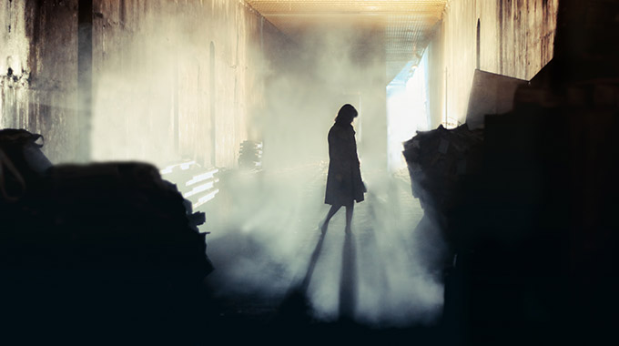 A ghostly shadow in a foggy room.