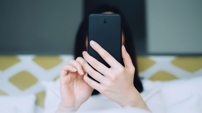 Woman is on social media on her smartphone 