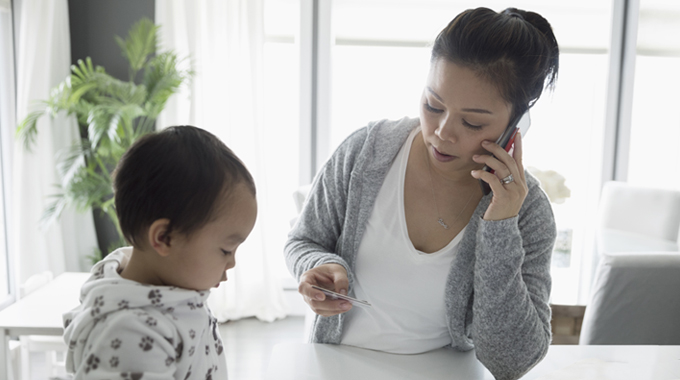 Mom on phone with credit card