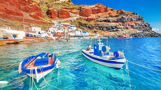 Two boats off the shore of a Greek island