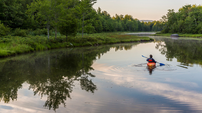 A kayaker in a creek at Acadia National Park