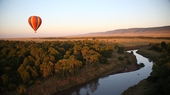 A hot air balloon safari in Kenya, above a river