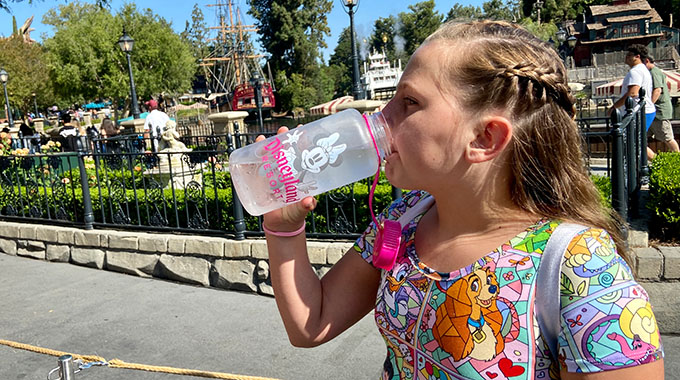 Charlie drinking water from a reusable bottle