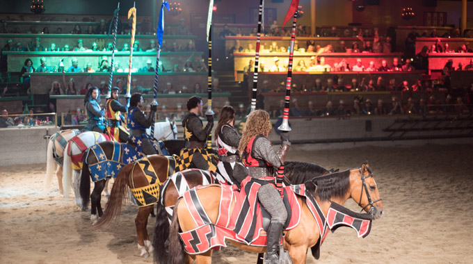 Knights on horseback hold their lances