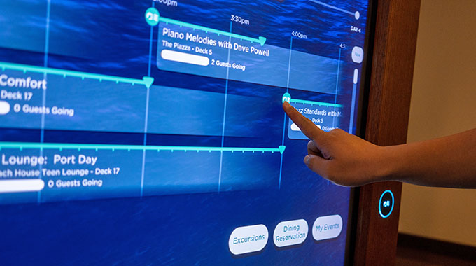 A MedallionClass screen aboard a Princess Cruises ship, with someone tapping on their itinerary for the day