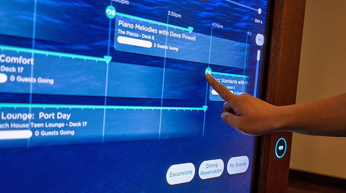 A MedallionClass screen aboard a Princess Cruises ship, with someone tapping on their itinerary for the day