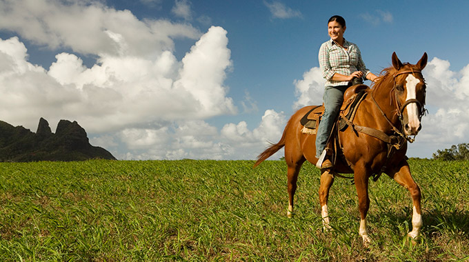 A woman riding a horse in Hawai‘i