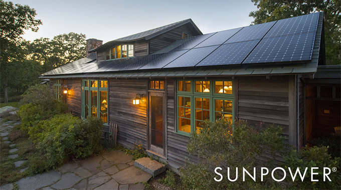 A home with solar panels on the roof in the evening