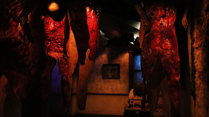Flaps of human skin hang from the ceiling in a maze at Universal Studios Hollywood's Halloween Horror Nights