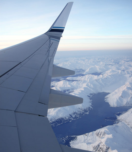 The view out of a plane window over mountains in Alaska