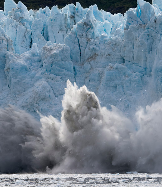 A glacier calves at Glacier Bay