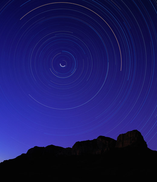 A timelapse image of stars over the Guadalupe Mountains