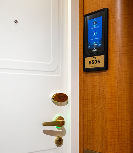 A door to a Princess Cruises guest stateroom, with a green light ring to indicate it was unlocked by an OceanMedallion