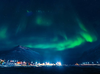 The aurora borealis at night above Longyearbyen, Norway
