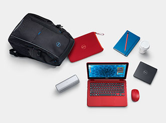 A Dell laptop surrounded by tech accessories
