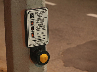 Image of a crosswalk button taken at a high aperture